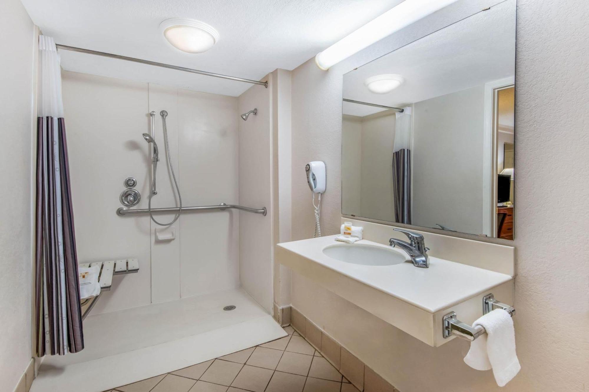 Double Room Two Double Beds Roll Shower Courtyard View Mobility Accessible or Non-Smoking